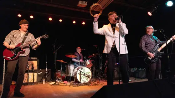 The Silverteens at the VFW Uptown in color. Mark is holding a tambourine above his head.